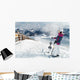 Young female skier admiring the stunning view Wall Mural