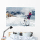 Young female skier admiring the stunning view Wall Mural