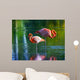 Two pink flamingos standing in the water. Stylized photo Wall Mural