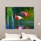 Two pink flamingos standing in the water. Stylized photo Wall Mural