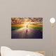 Happy Woman Jumping On Long Straight Road, Way Towards Sun Wall Decal