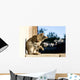 Tabby cat grooming itself. Selective focus. Wall Mural