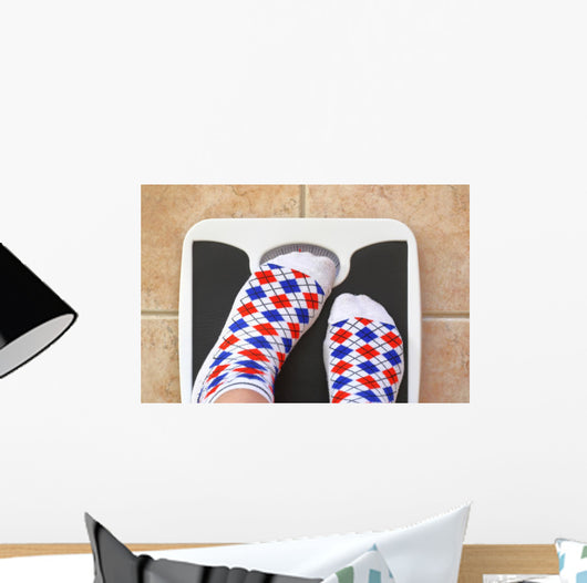 Woman's feet on bathroom scale. Diet concept Wall Decal