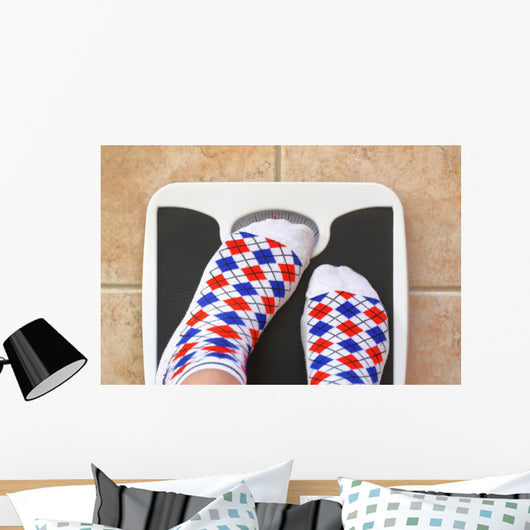 Woman's feet on bathroom scale. Diet concept Wall Decal