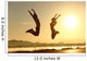 Fitness couple jumping happy at sunset Wall Mural