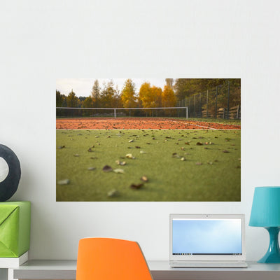 Empty Tennis Court Covered With Leaves Wall Decal shown on a wall