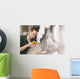 Male technician repairing agriculture machinery Wall Mural