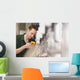 Male technician repairing agriculture machinery Wall Mural