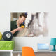 Male technician repairing agriculture machinery Wall Mural
