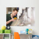 Male technician repairing agriculture machinery Wall Mural