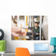 Male technician repairing agriculture machinery Wall Mural