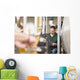 Male technician repairing agriculture machinery Wall Mural