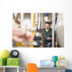 Male technician repairing agriculture machinery Wall Mural