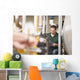 Male technician repairing agriculture machinery Wall Mural