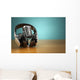 Vintage microphone and headphones on green background. Concept a Wall Mural