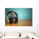 Vintage microphone and headphones on green background. Concept a Wall Mural