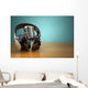 Vintage microphone and headphones on green background. Concept a Wall Mural