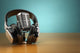 Vintage Microphone And Headphones On Green Background. Concept A Wall Decal