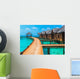 Over water bungalows with steps into amazing green lagoon Wall Mural