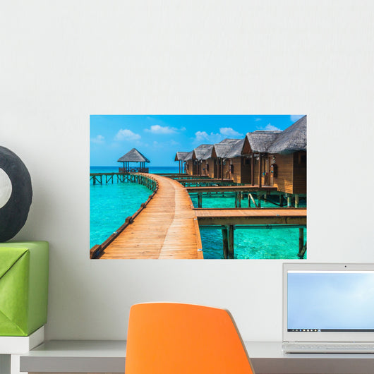 Over water bungalows with steps into amazing green lagoon Wall Mural