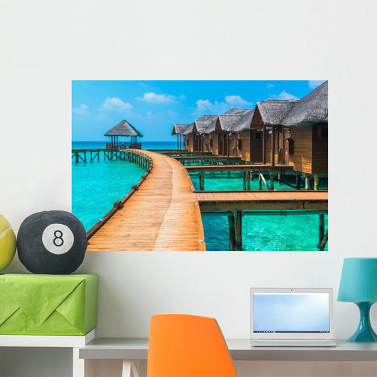 Over water bungalows with steps into amazing green lagoon Wall Mural