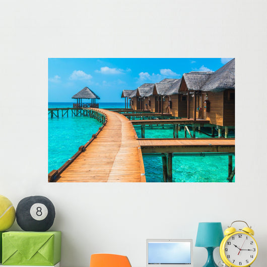 Over water bungalows with steps into amazing green lagoon Wall Mural