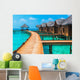 Over water bungalows with steps into amazing green lagoon Wall Mural