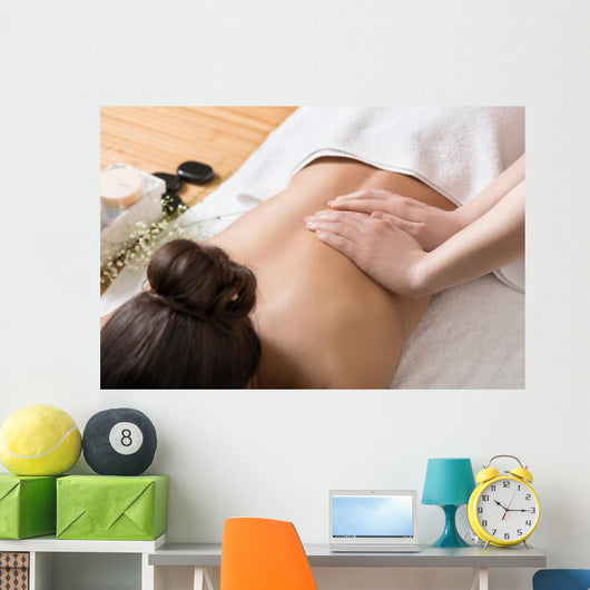 Woman Receiving Back Massage in Spa Center Wall Mural