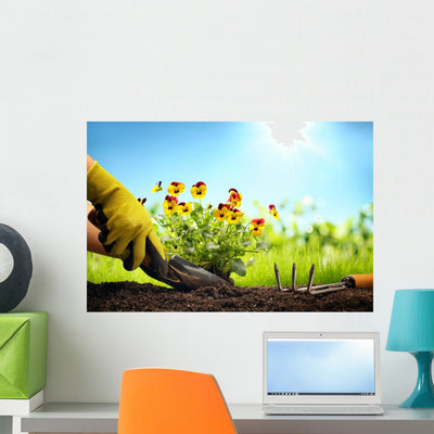 Planting Flowers In A Garden Wall Decal shown on a wall