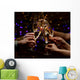 Clinking glasses of champagne in hands on lights background Wall Mural