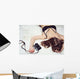 Pretty girl lying on the bed in bra with a camera Wall Mural