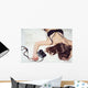 Pretty girl lying on the bed in bra with a camera Wall Mural