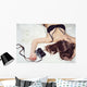 Pretty girl lying on the bed in bra with a camera Wall Mural