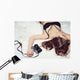Pretty girl lying on the bed in bra with a camera Wall Mural