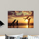 Father and children playing on the beach Wall Mural