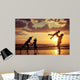 Father and children playing on the beach Wall Mural