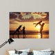 Father and children playing on the beach Wall Mural