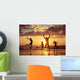 Father and children playing on the beach Wall Mural