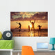 Father and children playing on the beach Wall Mural