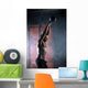 Beautiful athlete doing kettlebell swings. Profile picture. Athl Wall Mural