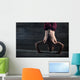 Athlete with naked torso doing push-ups on his hands while stand Wall Mural