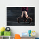 Athlete with naked torso doing push-ups on his hands while stand Wall Mural