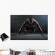 Athlete with a beautiful body and naked torso Wall Mural
