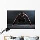Athlete with a beautiful body and naked torso Wall Mural