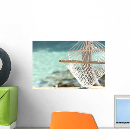 Travel concept with a hammock in a tropical beach Wall Mural