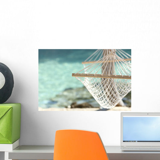 Travel concept with a hammock in a tropical beach Wall Mural