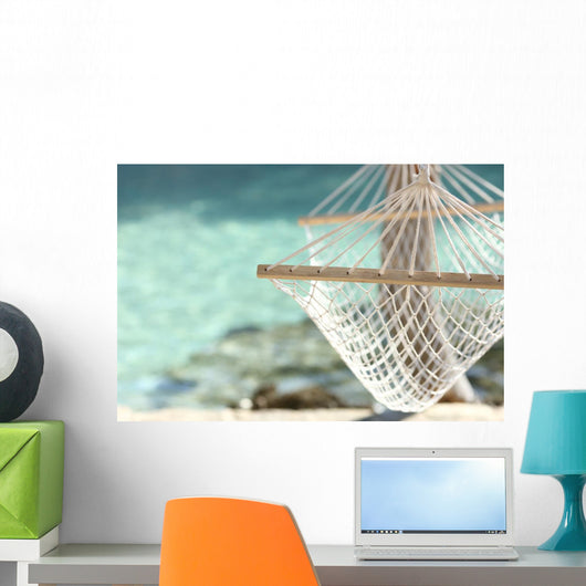 Travel concept with a hammock in a tropical beach Wall Mural