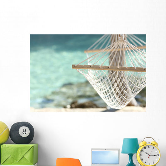 Travel concept with a hammock in a tropical beach Wall Mural