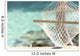 Travel concept with a hammock in a tropical beach Wall Mural
