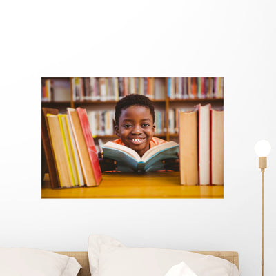 Cute Boy Reading Book In Library Wall Decal 2 shown on a wall